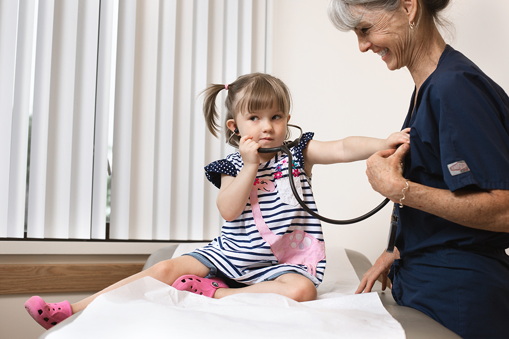 Female child with doctor