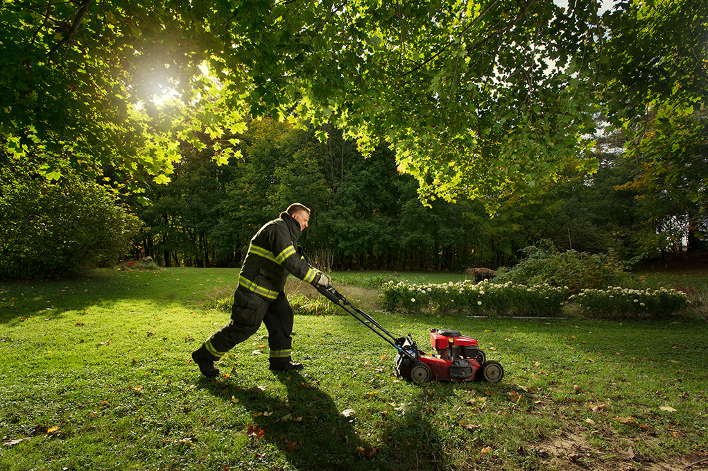 Firefighter Mowing Grass